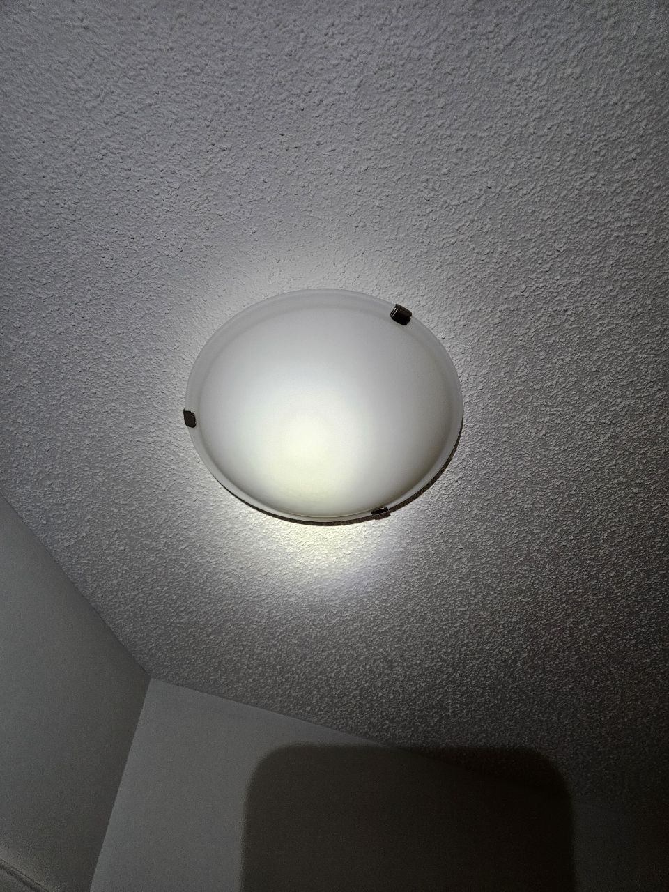 Round ceiling light mounted in Calgary home